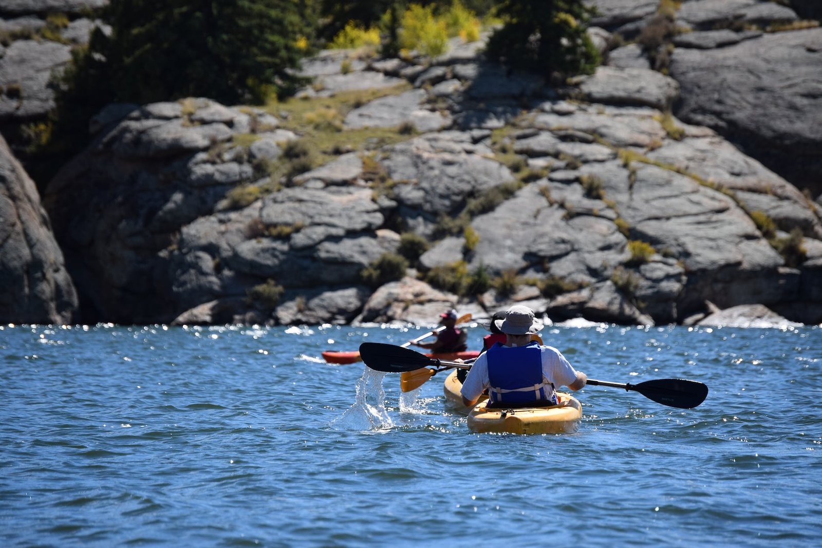 photo of people in kayak on a sunny day