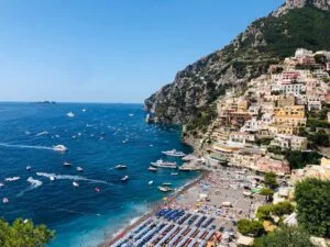 amazing view of coastal town on green cliff shore