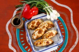 close up shot of empanadas in a bowl