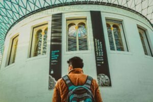 a man wearing brown jacket and backpack